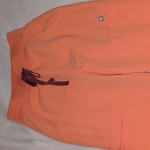 FIGS Coral orange scrub pants